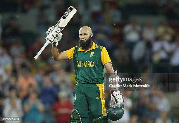 Hashim Amla of South Africa celebrates and acknowledges the crowd after scoring a century during game three of the One Day International Series...