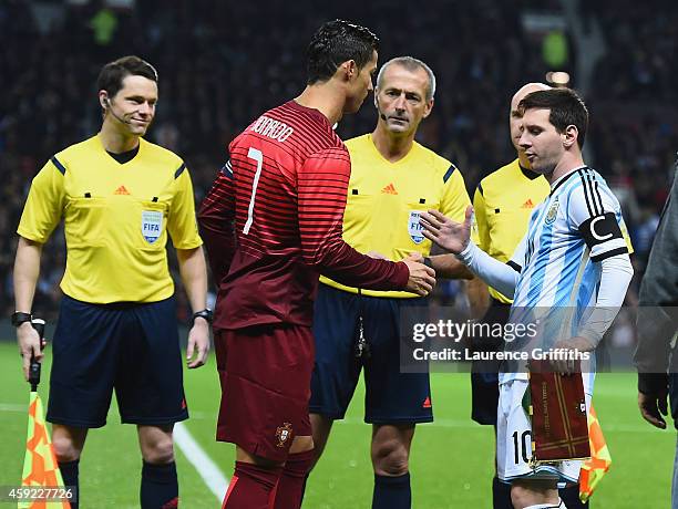 Lionel Messi of Argentina shakes hands with Cristiano Ronaldo of Portugal prior to the International Friendly match between Argentina and Portugal at...