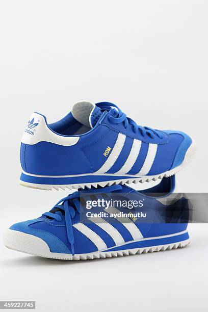 adidas shoes in store window - adidas shoes stock pictures, royalty-free photos & images