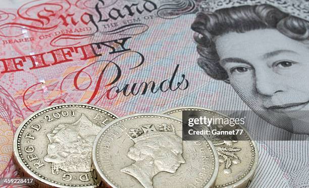 fifty pound note and coins - editorial stock pictures, royalty-free photos & images