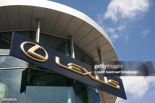 golden lexus signage on car retailer`s building - lexus stock pictures, royalty-free photos & images