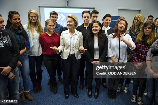 German defence minister Ursula von der Leyen poses for a picture while meeting with a group of school children visiting a new army recruitment /...