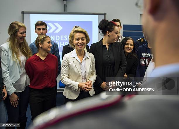 German defence minister Ursula von der Leyen poses for a picture while meeting with a group of school children visiting a new army recruitment /...