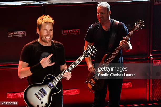 Musicians Chad Kroeger and Mike Kroeger of Nickelback perform at iHeartRadio Theater on November 18, 2014 in Burbank, California.