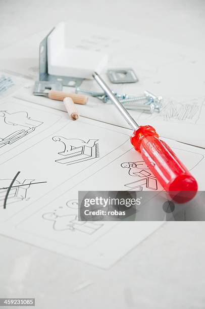 ikea instruction manual with screwdriver and screws - furniture instructions stock pictures, royalty-free photos & images