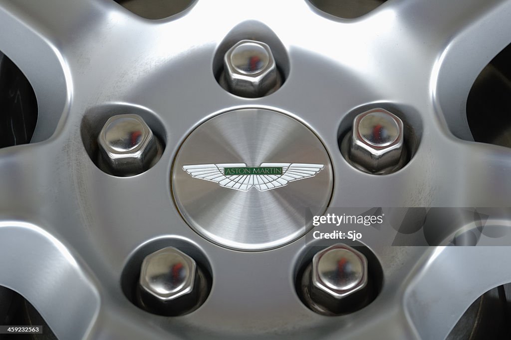 Aston Martin wheel close up with wheelnuts and Aston logo