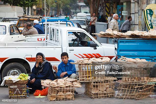 people selling bread - cairo traffic stock pictures, royalty-free photos & images