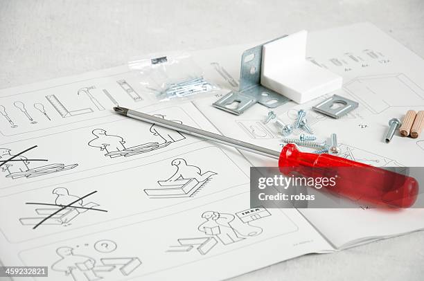 ikea instruction manual with screwdriver and screws - handbook stock pictures, royalty-free photos & images