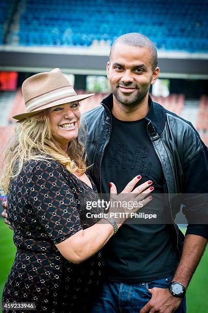 Tony Parker with his mother Pamela Firestone at the Parc des Prince on september 17, 2014 in Paris, France.