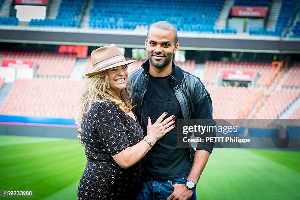 Tony Parker with his mother Pamela Firestone at the Parc des Prince on september 17, 2014 in Paris, France.