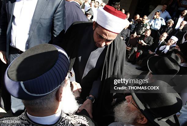 Sheikh Samir Aasi, chief Imam in Akko shakes hand with Sephardi Chief Rabbi of Israel Shlomo Amar during a visit by chief clerics and representatives...