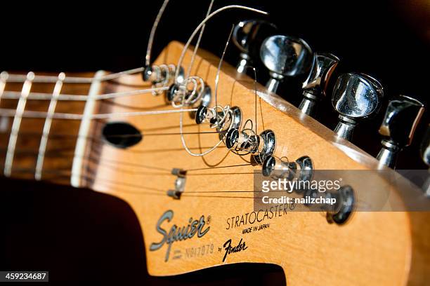 closeup of fender stratocaster guitar - fender guitar stock pictures, royalty-free photos & images