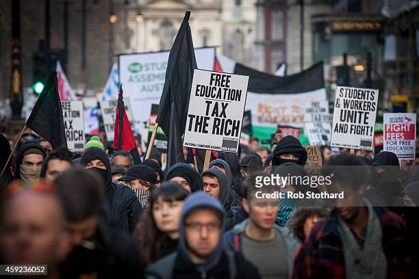 Protesters walk down The Strand during a march against student university fees on November 19, 2014 in London, England. A coalition of student groups...