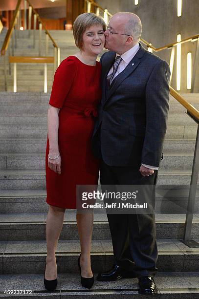 Leader Nicola Sturgeon is congratulated by her husband Peter Murrell following being formally voted in as first minister of Scotland at the Scottish...