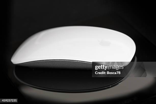 apple computer magic mouse - apple magic wireless mouse stock pictures, royalty-free photos & images