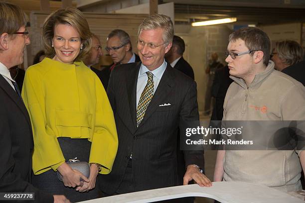 Queen Mathilde and King Philippe of Belgium visit Mathy by Bois in Couvin on November 19, 2014 in Namur, Belgium.