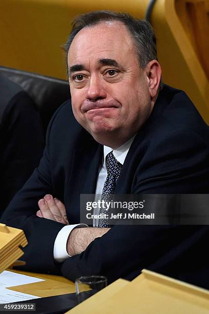 Alex Salmond takes a seat in the chamber as SNP leader Nicola Sturgeon is formally voted in as first minister of Scotland at the Scottish Parliament...
