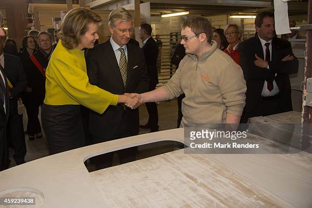 Queen Mathilde and King Philippe of Belgium visit Mathy by Bois in Couvin on November 19, 2014 in Namur, Belgium.