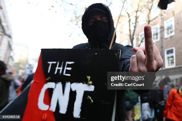 Protester gestures during a protest against fees and cuts in the education system on November 19, 2014 in London, England. A coalition of student...