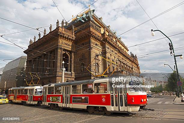 prague tram passing national theatre - prague tram stock pictures, royalty-free photos & images