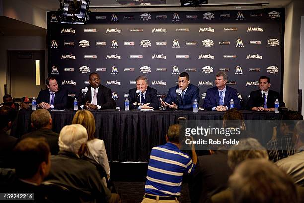 Giancarlo Stanton of the Miami Marlins speaks during a press conference as manager Mike Redmond , President of Baseball Operations Michael Hill ,...