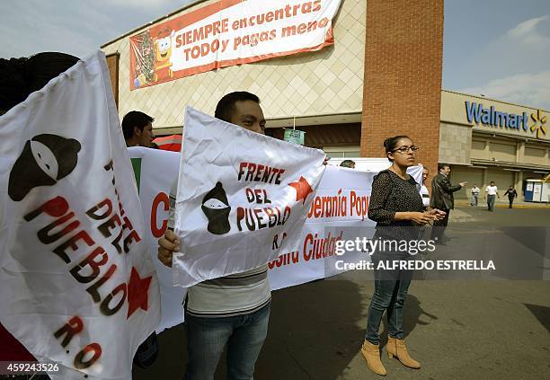 Members of civil associations "Red Mexicana contra la Inmunidad de Walmart" and "Frente del Pueblo" hold a protest in front of US giant Walmart...