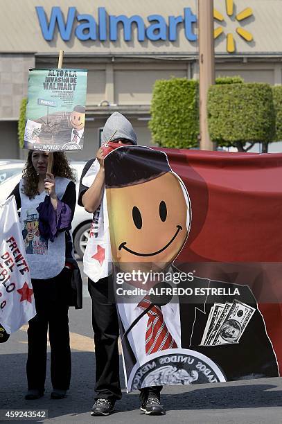 Members of civil associations "Red Mexicana contra la Inmunidad de Walmart" and "Frente del Pueblo" hold a protest in front of US giant Walmart...