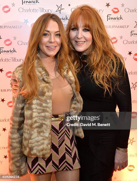 Lindsay Lohan and Charlotte Tilbury attend the launch of Charlotte Tilbury's 'Backstage Beauty Booth' counter in the Beauty Hall at Fenwick Of Bond...