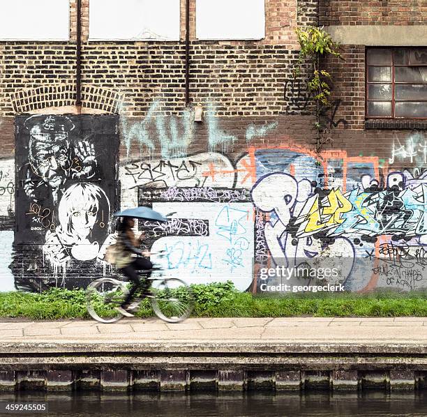 cycling on regent's canal - hackney stock pictures, royalty-free photos & images