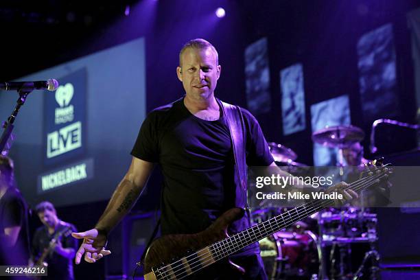 Mike Kroeger from the band Nickelback performs at iHeartRadio Theater on November 18, 2014 in Burbank, California.