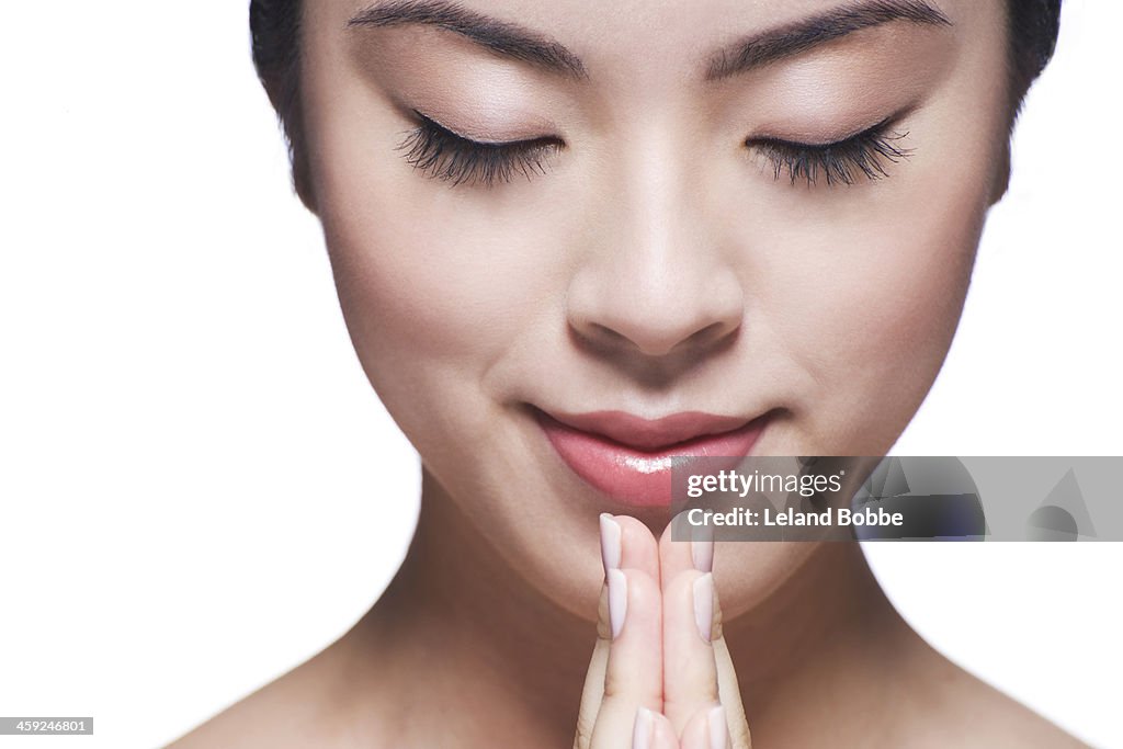 Beauty shot of Asian woman with eyes closed