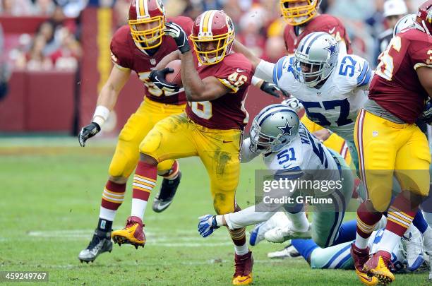 Alfred Morris of the Washington Redskins rushes the ball against the Dallas Cowboys at FedExField on December 22, 2013 in Landover, Maryland.