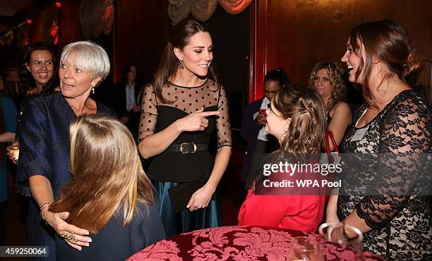 Catherine, Duchess of Cambridge gestures towards a finalist in the child champion award, Georgia Alvey from Cotsford Junior school in County Durham...