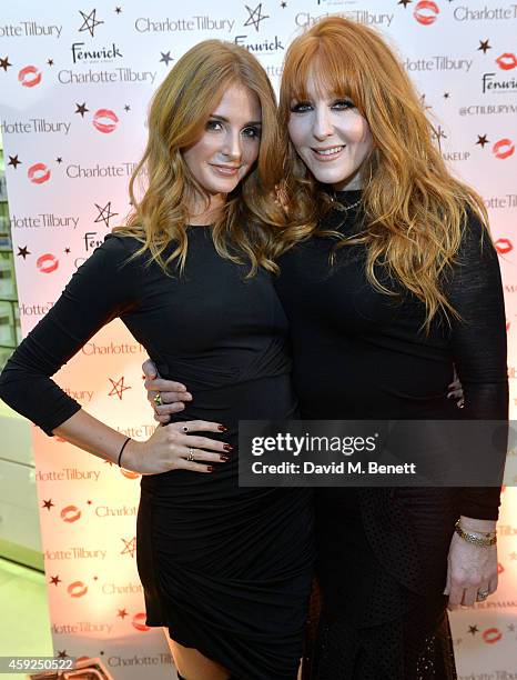 Millie Mackintosh and Charlotte Tilbury attend the launch of Charlotte Tilbury's 'Backstage Beauty Booth' counter in the Beauty Hall at Fenwick Of...