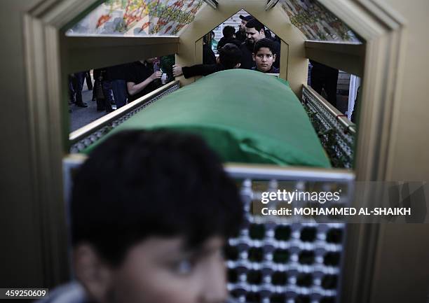 Bahraini Shiite Muslims boys take part in the Arbaeen religious festival which marks the 40th day after Ashura commemorating the seventh century...
