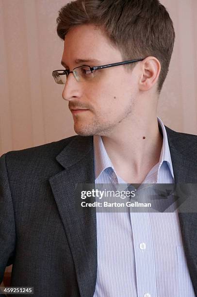 Former intelligence contractor Edward Snowden poses for a photo during an interview in an undisclosed location in December 2013 in Moscow, Russia....