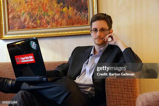 Former intelligence contractor Edward Snowden poses for a photo during an interview in an undisclosed location in December 2013 in Moscow, Russia....