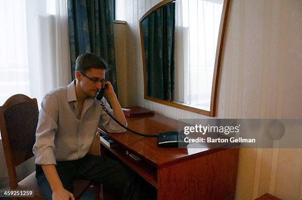 Former intelligence contractor Edward Snowden poses for a photo during an interview in an undisclosed location in December 2013 in Moscow, Russia....