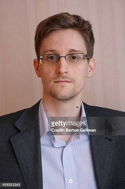 Former intelligence contractor Edward Snowden poses for a photo during an interview in an undisclosed location in December 2013 in Moscow, Russia....