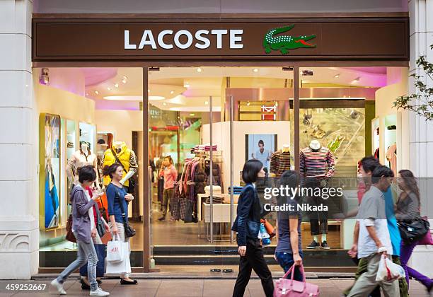 lacoste store in shanghai, china - lacoste designer label stock pictures, royalty-free photos & images