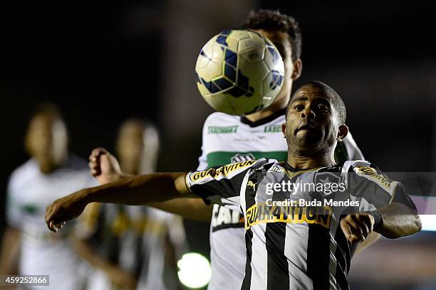 Junior Cesar of Botafogo struggles for the ball during a match between Botafogo and Figueirense as part of Brasileirao Series A 2014 at Sao Januario...