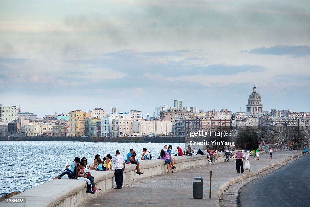 Tourists and Residents Enjoying the Malecón of Havana Cuba