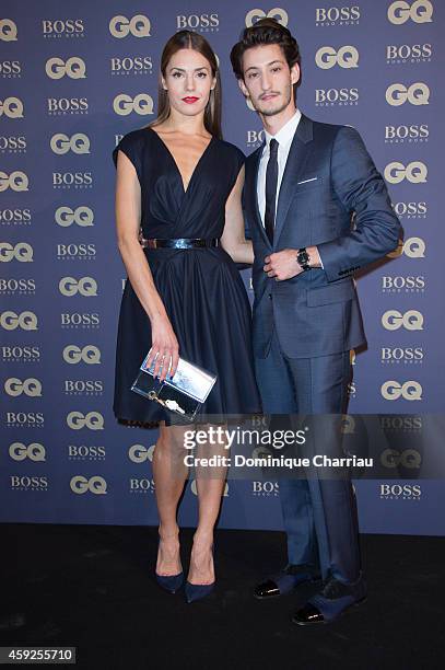 Pierre Ninet and Natasha Andrews attend the GQ Men Of The Year Awards 2014 Photocall In Paris at Musee d'Orsay on November 19, 2014 in Paris, France.