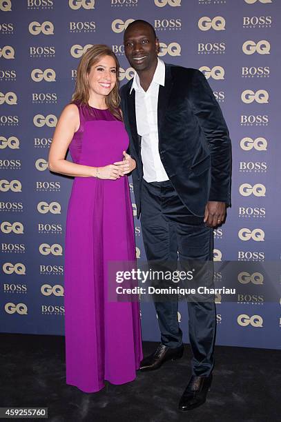 Lea Salame and Omar Sy attend the GQ Men Of The Year Awards 2014 Photocall In Paris at Musee d'Orsay on November 19, 2014 in Paris, France.