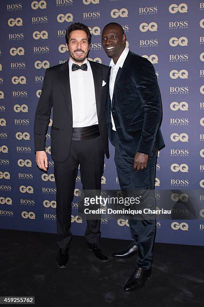 Vincent Elbaz and Omar Sy attend the GQ Men Of The Year Awards 2014 Photocall In Paris at Musee d'Orsay on November 19, 2014 in Paris, France.