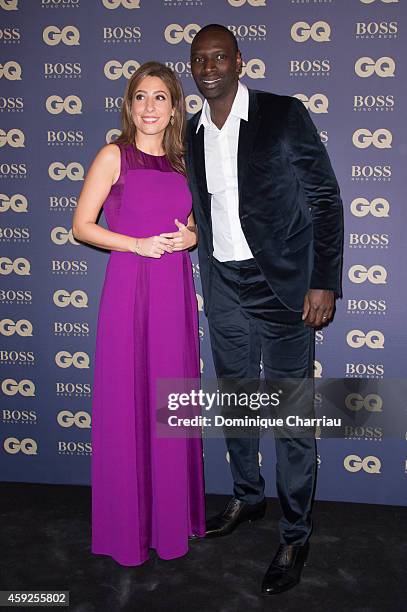 Lea Salame and Omar Sy attend the GQ Men Of The Year Awards 2014 Photocall In Paris at Musee d'Orsay on November 19, 2014 in Paris, France.