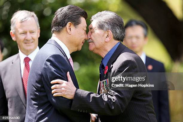 President Xi Jinping Of China is greeted with a hongi by Government House Kaumatua Lewis Moeau during a State Welcome at Government House on November...