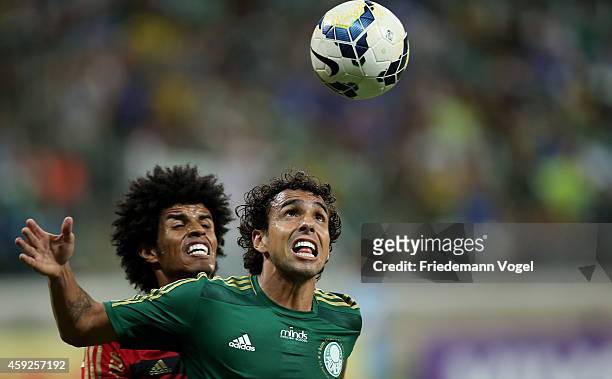 Diogo of Palmeiras fights for the ball with Pascoa of Recife during the match between Palmeiras and Sport Recife for the Brazilian Series A 2014 at...