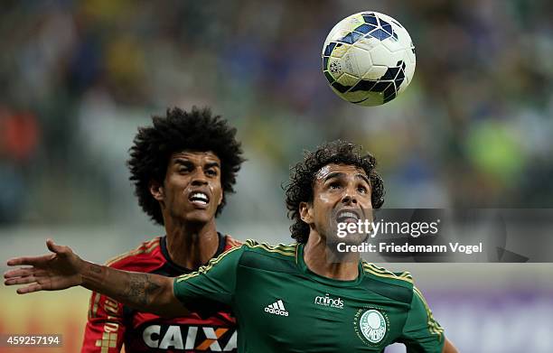 Diogo of Palmeiras fights for the ball with Pascoa of Recife during the match between Palmeiras and Sport Recife for the Brazilian Series A 2014 at...