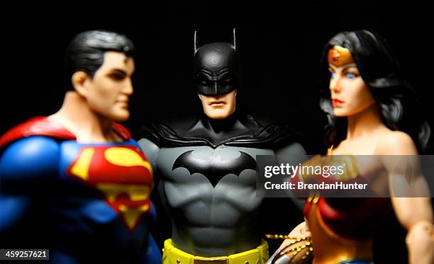 threesome - dc comics stock pictures, royalty-free photos & images